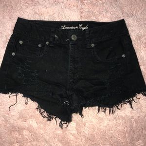 Black American eagle distressed shorts.